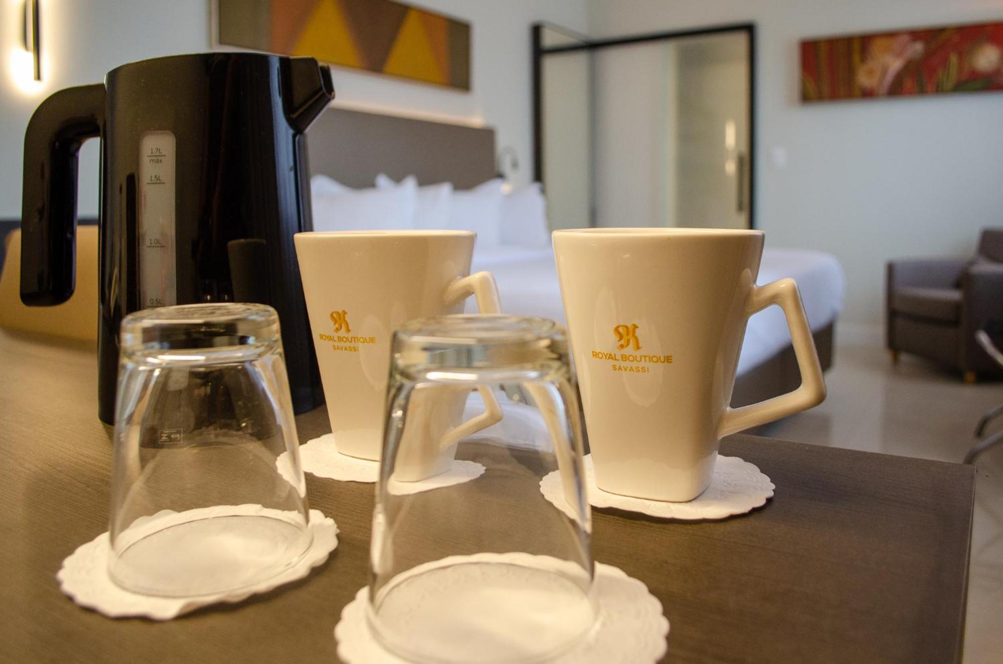 בלו הוריזונטה Royal Boutique Savassi Hotel מראה חיצוני תמונה A coffee pot and two cups
